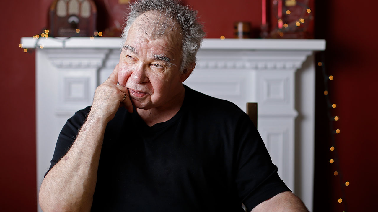 In this June 20, 2017, photo, John Prine poses in his offices in Nashville, Tenn. (AP Photo/Mark Humphrey)