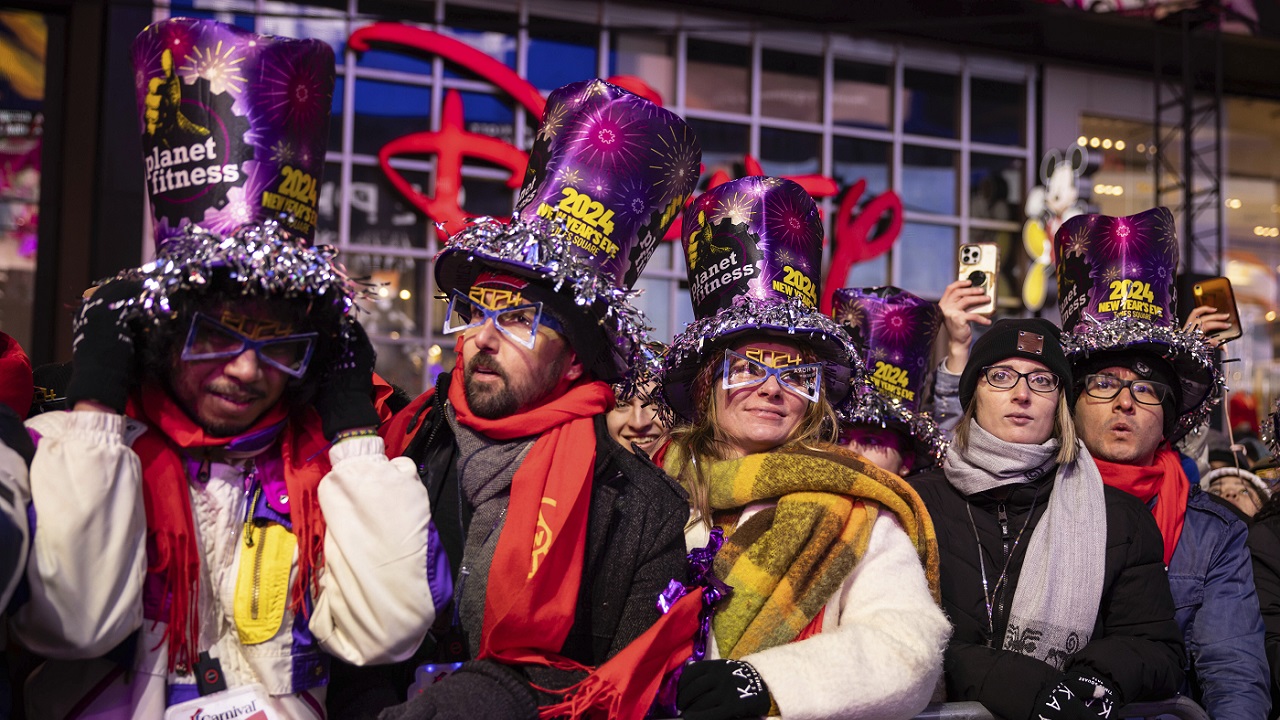 Revelers wearing 2024 glasses are seen during the New Year's Eve celebration in Times Square, Sunday, Dec. 31, 2023, in New York. (AP Photo/Yuki Iwamura)