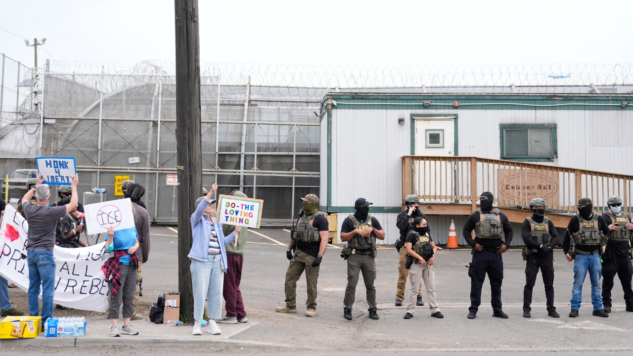 Protesters and police stand outside Delaney Hall in Newark, NJ on May 27, 2026