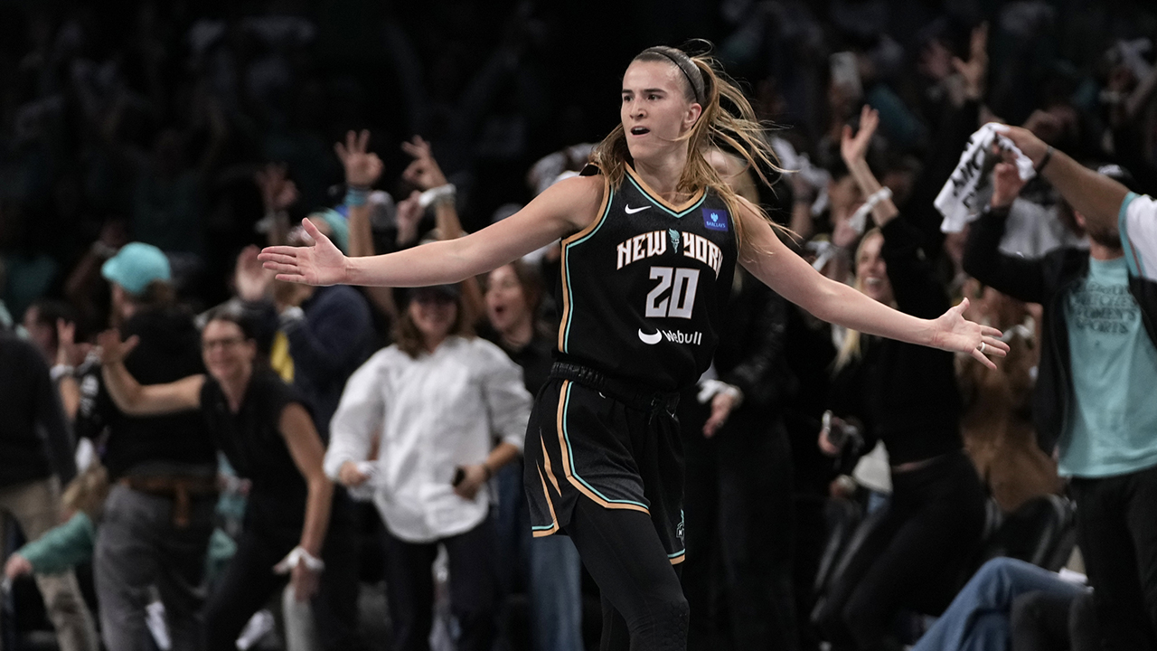New York Liberty's Sabrina Ionescu (20) reacts after scoring during the first half in Game 1 of a WNBA basketball final playoff series against the Minnesota Lynx, Thursday, Oct. 10, 2024, in New York.