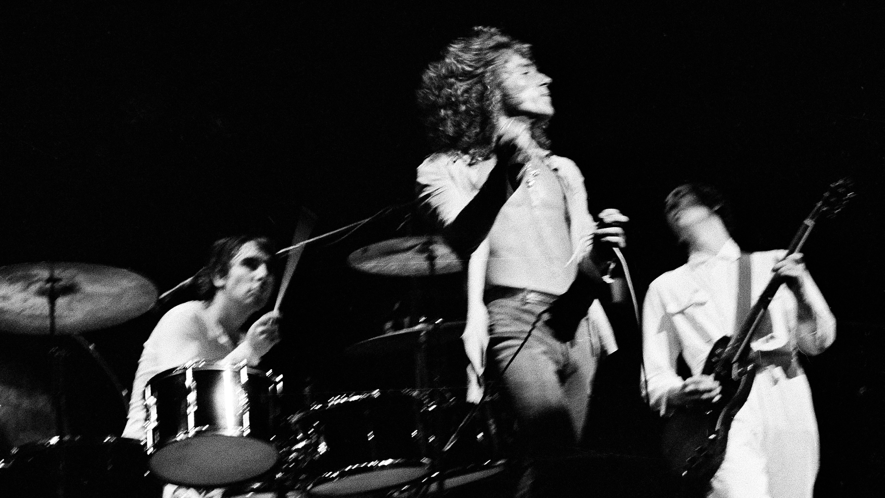 Singer Roger Daltrey of the Who twirls his hand microphone by its cord during the final performance of the rock opera &quot;Tommy,&quot; at the Metropolitan Opera House in New York, June 7, 1970. Drummer Keith Moon and lead guitarist Pete Townshend perform in the background.