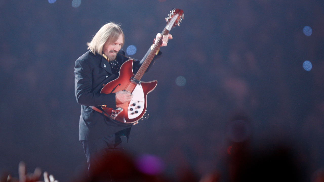 Tom Petty plays guitar as Tom Petty &amp; the Heartbreakers perform during the halftime show of the Super Bowl at University of Phoenix Stadium on Feb. 3, 2008, in Glendale, Ariz.