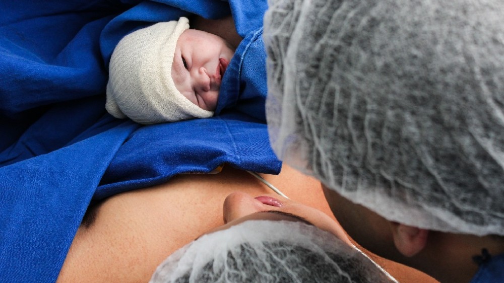 newborn baby with parents