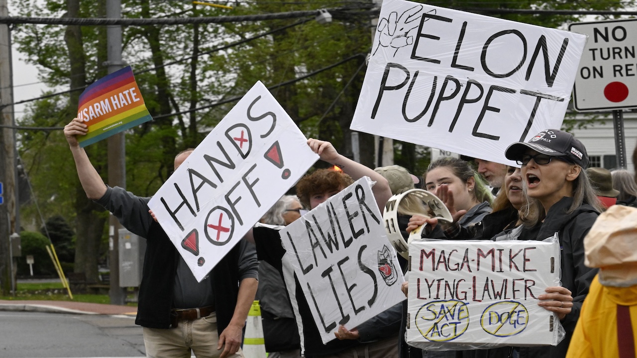 Protesters outside a town hall held by NY-17's Mike Lawler.