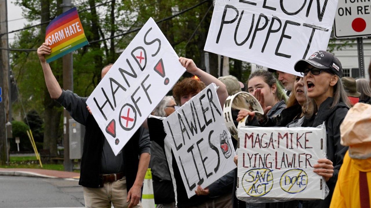 Protesters outside a town hall held by Mike Lawler