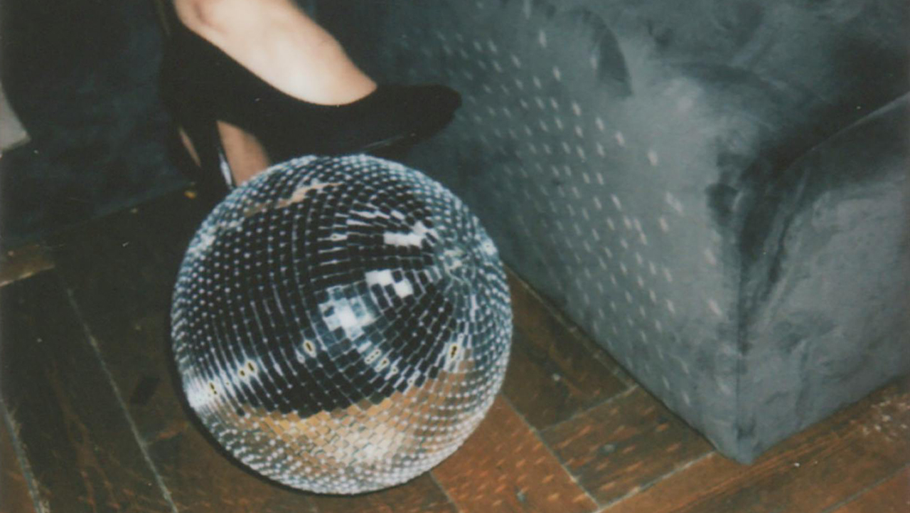 disco ball with woman's high-heeled pump