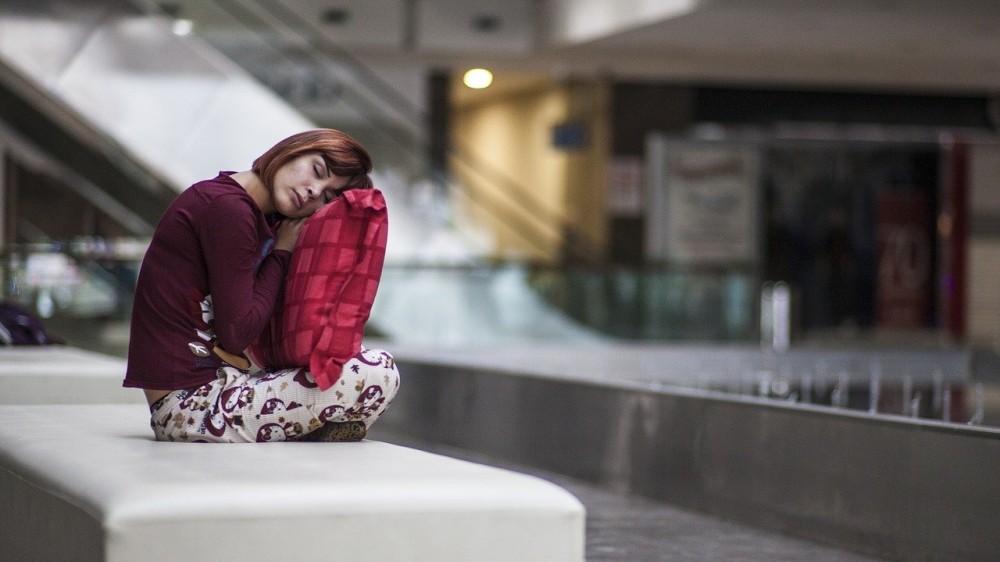 sleepy woman at airport