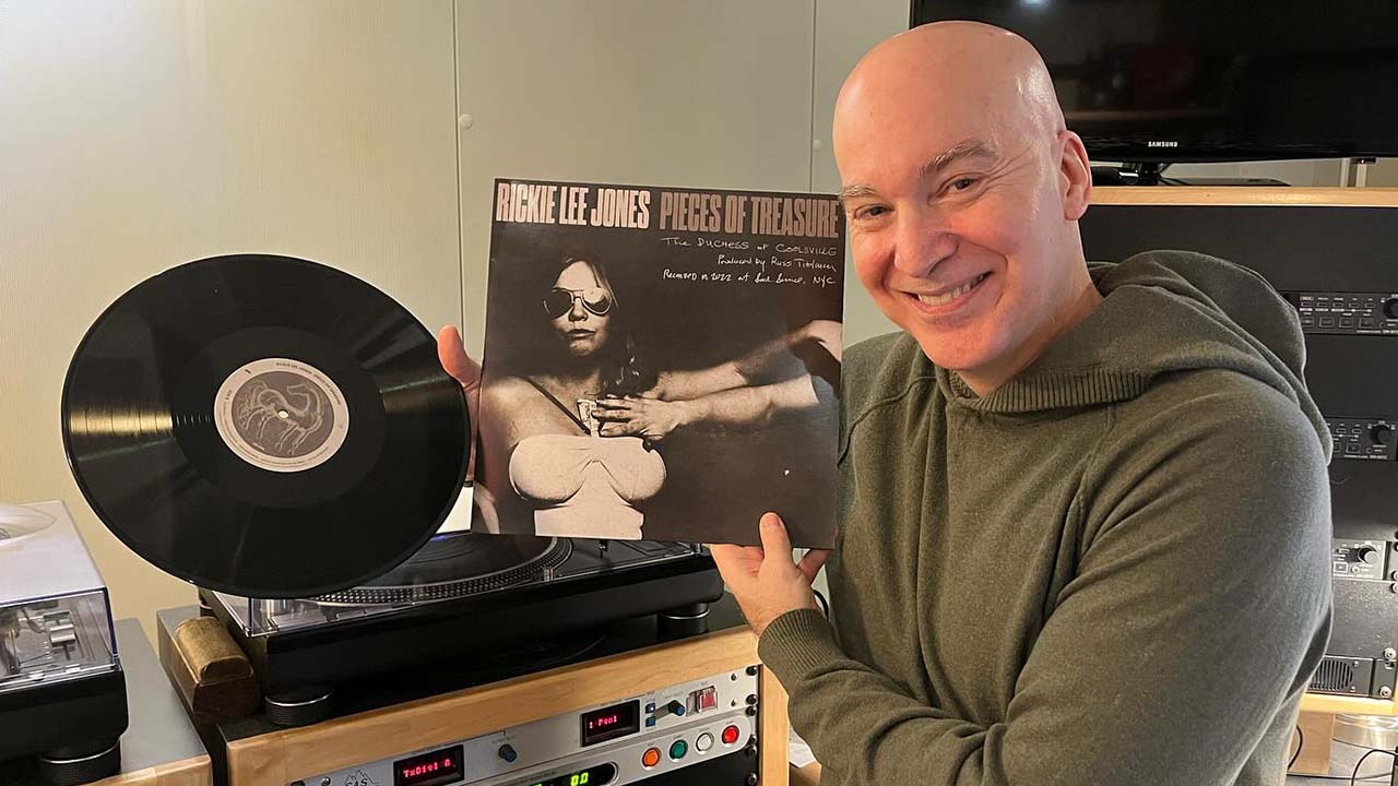 Eric Holland holding a Rickie Lee Jones album