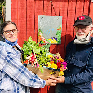 Rona Wasserman (left) admiring the fruits, and vegetables, of her labor from The Garden at TBT