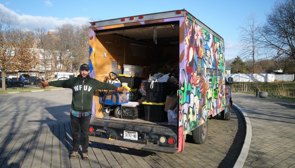 Benham Jones loads the truck (photo by Gus Philippas)